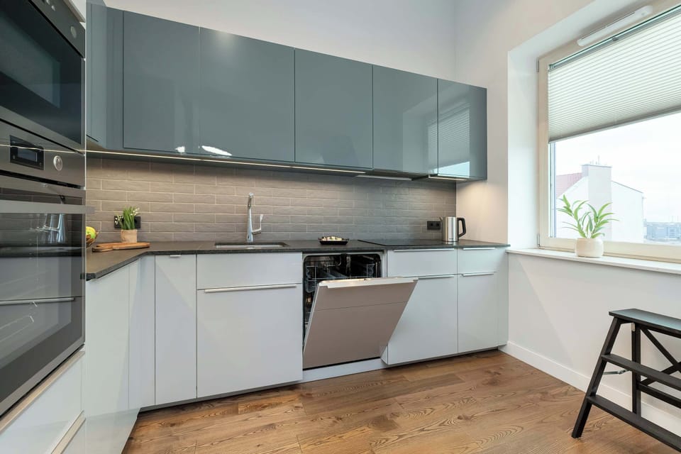 Another wide kitchen view with full equipment.