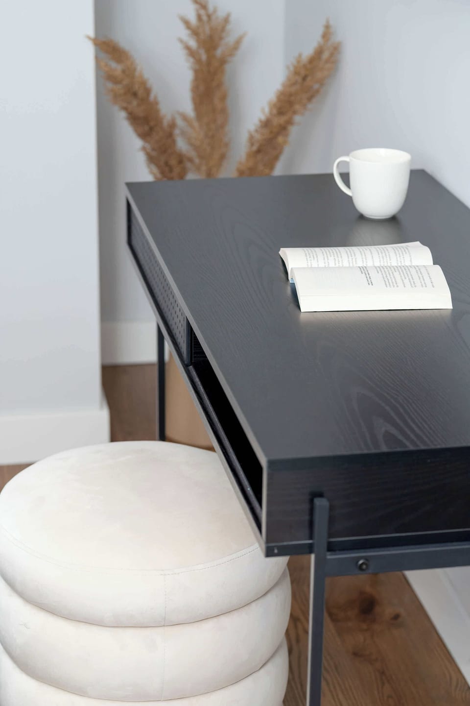 Comfortable desk with pouffe.