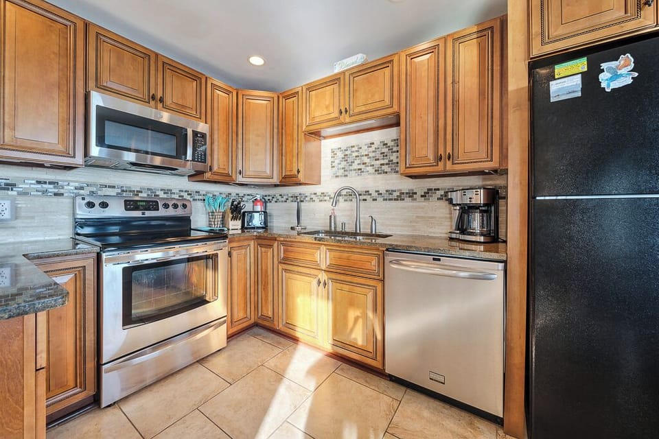 Stainless Appliances and lots of workspace.