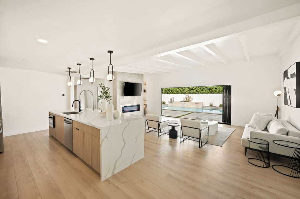 Our main kitchen features open floor plan overlooking outdoor pool.