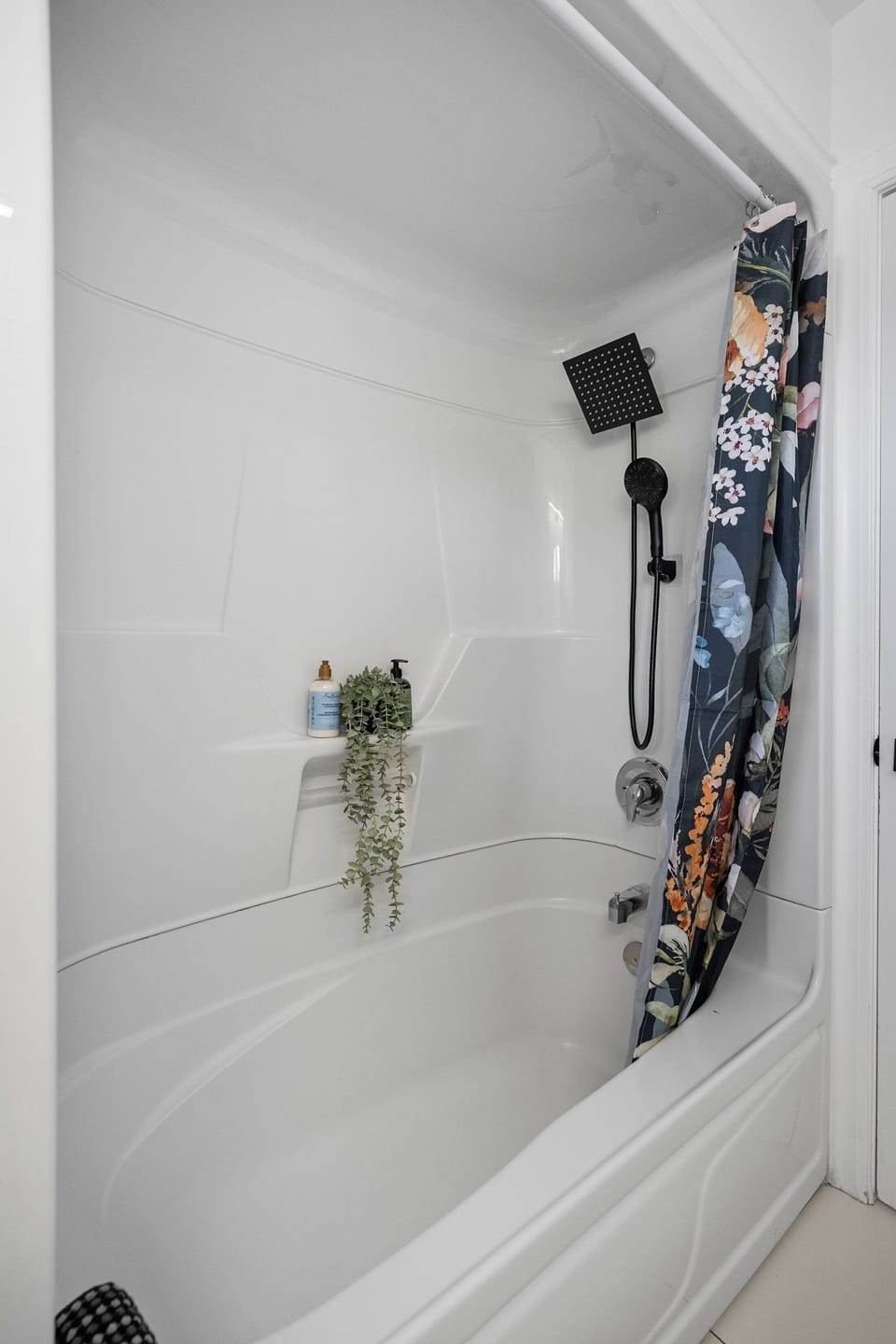 Soak & refresh a crisp tub with a modern rain-shower head.