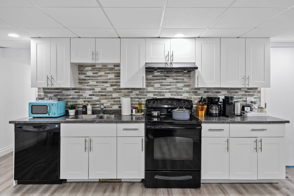 Modern backsplash and all the tools you need for a home-cooked meal.