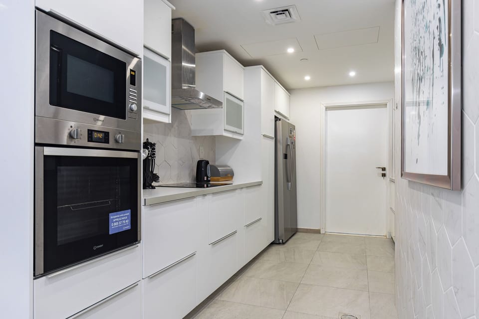 Deluxe Penthouse, 4 Bedrooms, City View | Private kitchen | Coffee/tea maker, electric kettle, toaster, cleaning supplies