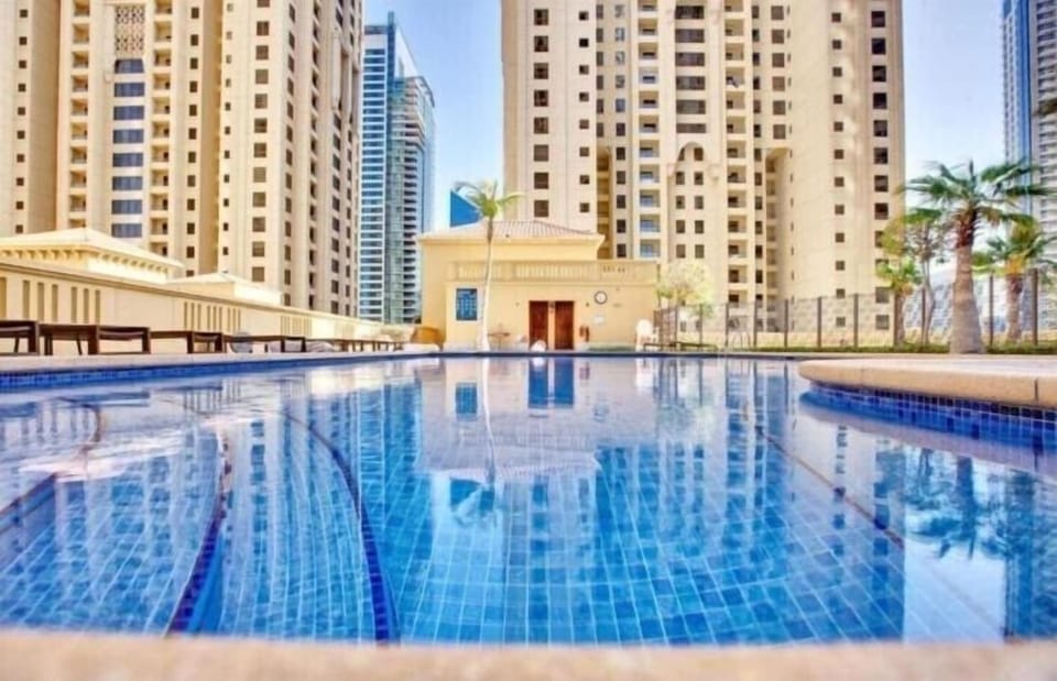 Outdoor pool, pool umbrellas, sun loungers