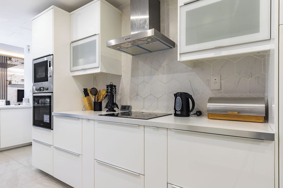 Deluxe Penthouse, 4 Bedrooms, City View | Private kitchen | Coffee/tea maker, electric kettle, toaster, cleaning supplies
