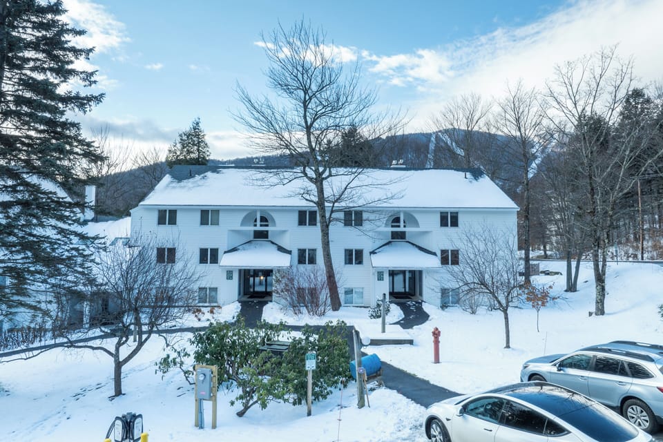 Your winter mountain retreat awaits! Imagine cozy evenings in this snow-covered condo, where towering pines frame your peaceful sanctuary and the crisp mountain air fills your lungs with pure tranquility.