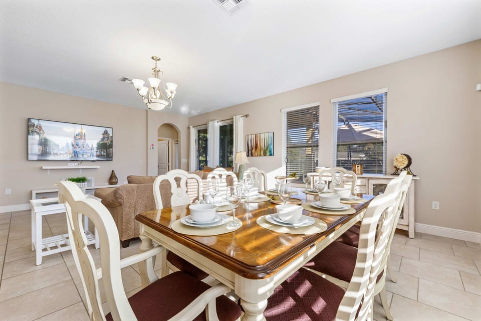 Dining table with seating for family meals, adjacent to the kitchen.