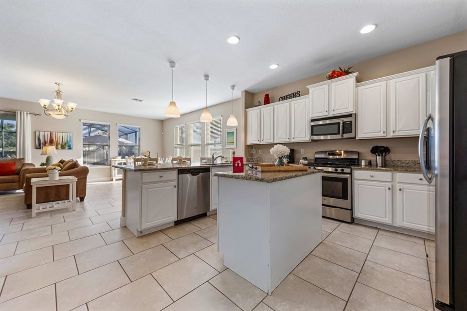 Fully equipped kitchen with stove, oven, microwave, and dishwasher.