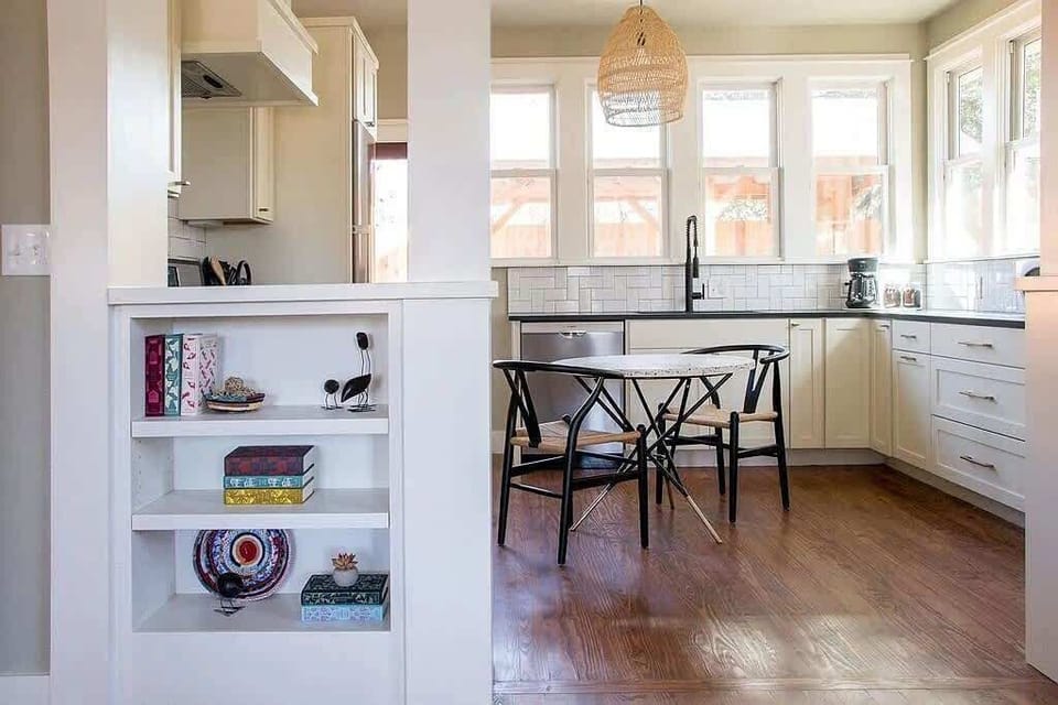 Kitchen: Bright and airy space with modern appliances and charming decor for culinary adventures!