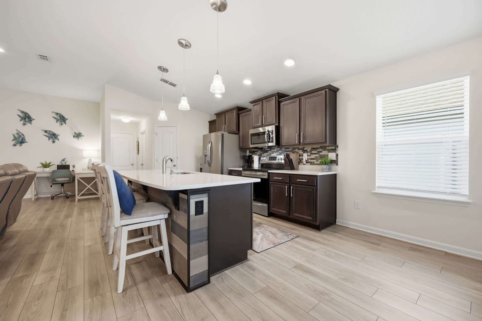 Cook, connect, and unwind—bar seating included!