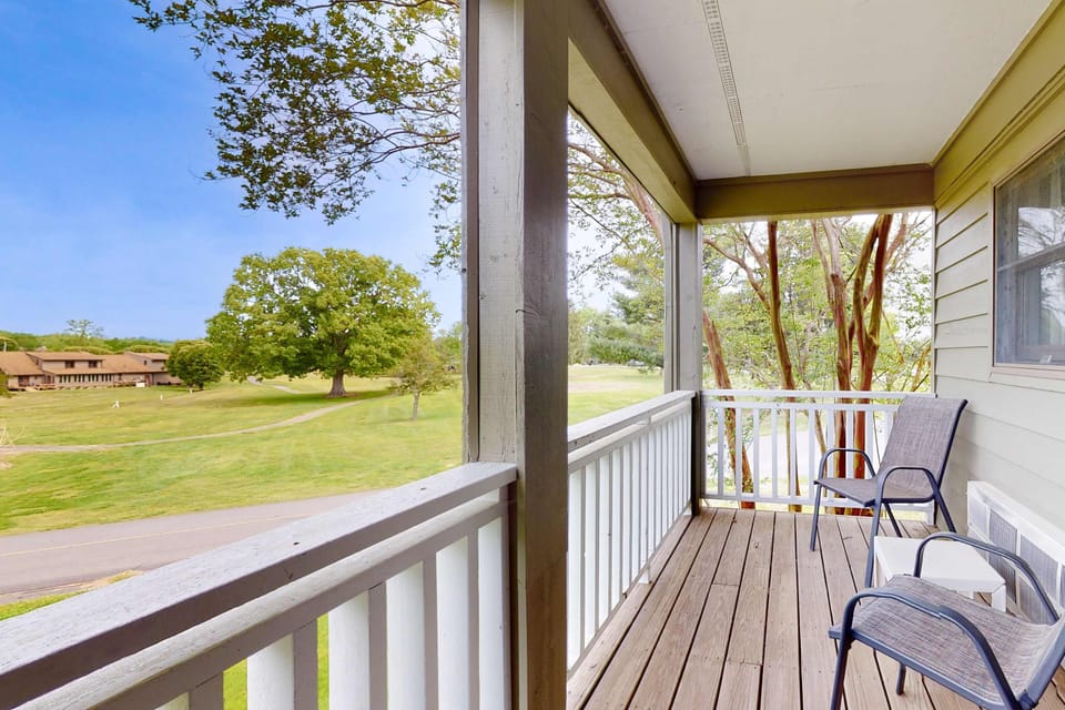 Covered private balcony with seating and scenic views. Perfect for couples, families, and weekenders. Enjoy fresh air, quiet mornings, and relaxing outdoor space at this studio retreat.