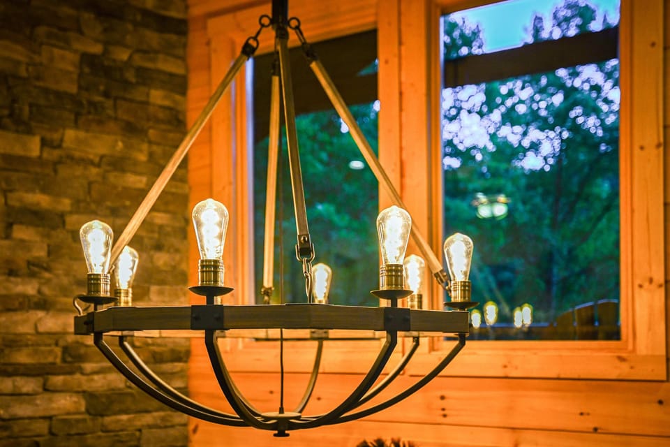 Vintage chandelier casts a warm glow, inviting memories over delicious meals!
