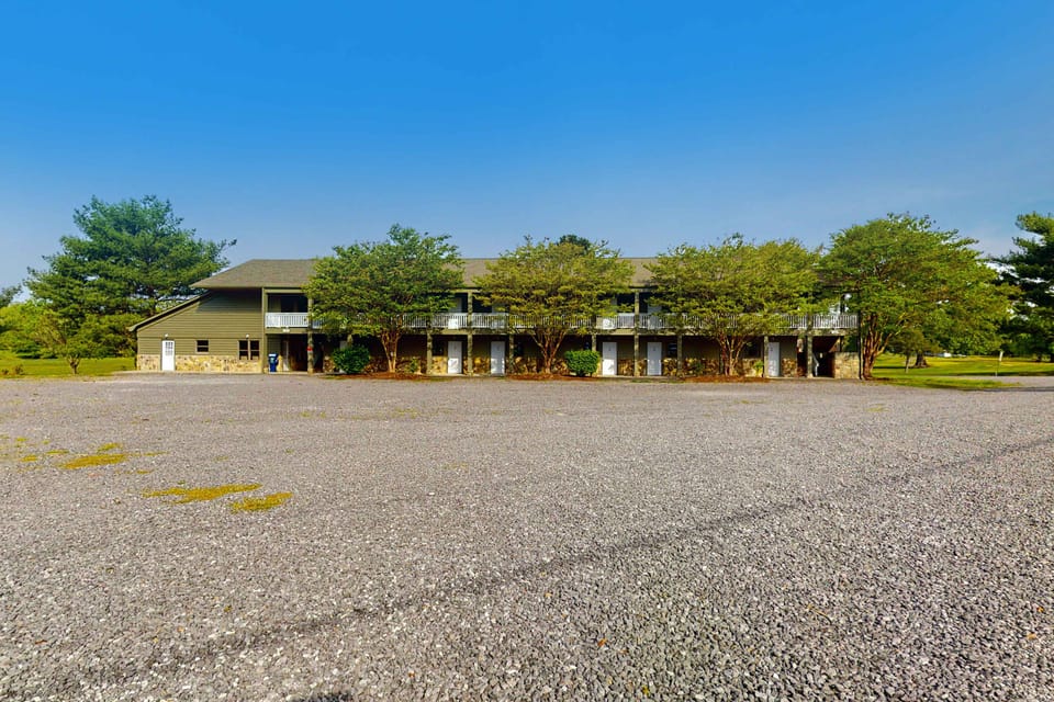 Expansive lot and charming trees, perfect for gathering and creating memories!