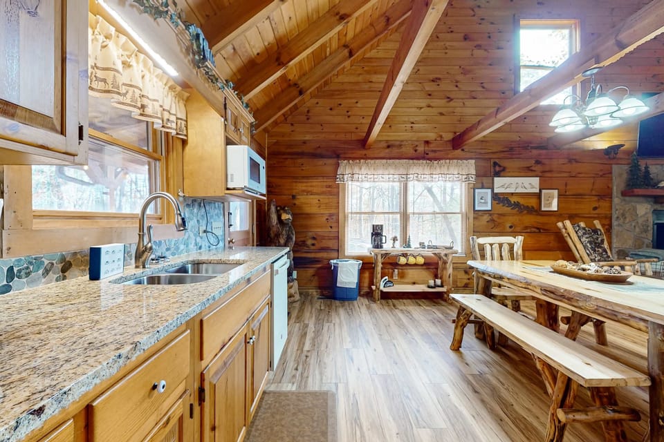 Delight in this spacious kitchen with rustic charm and scenic views for culinary adventures!