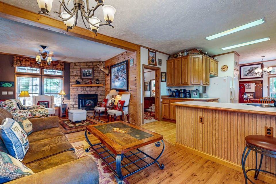 Living room retreat awaits. And, bask in charming decor and a warm ambiance with views for relaxation.