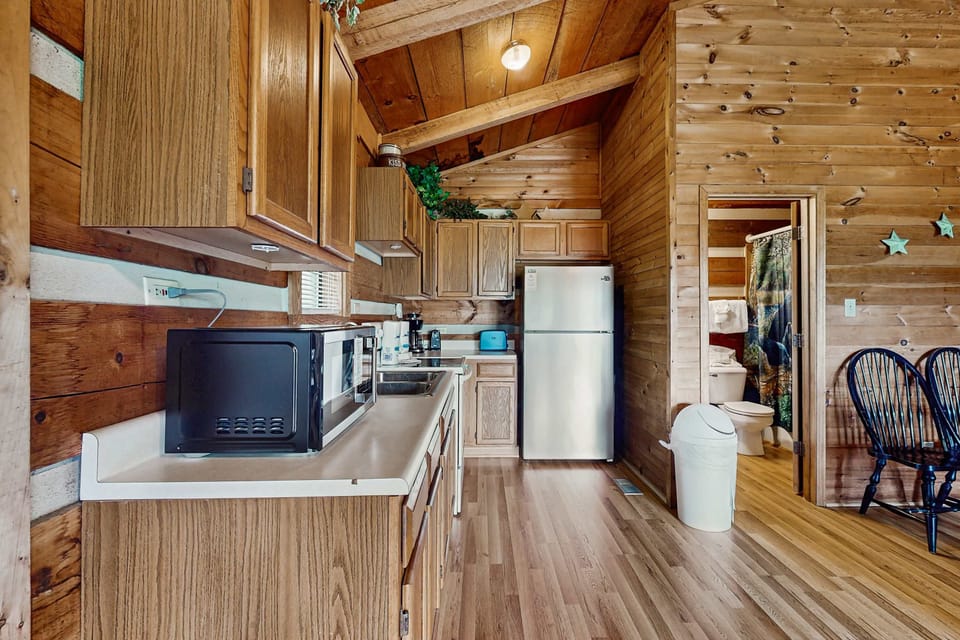 Stylish wooden accents and modern appliances await your culinary adventures!