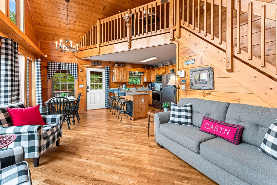 Spacious open-concept layout connecting living room, dining area, and kitchen. Perfect for families and group getaways.
