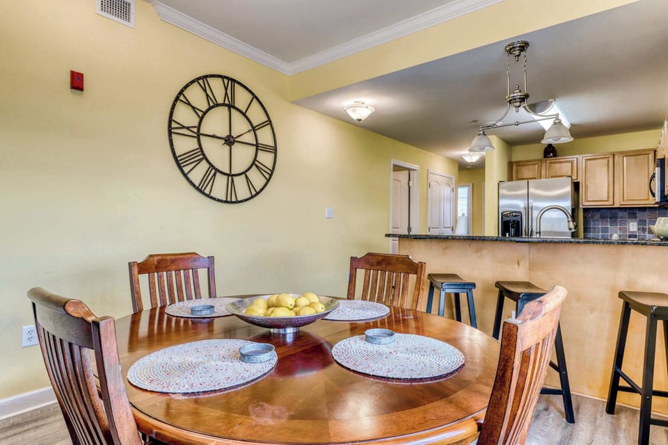 Dining Area, gather around the elegant table for meals and laughter in vibrant, sunny surroundings!