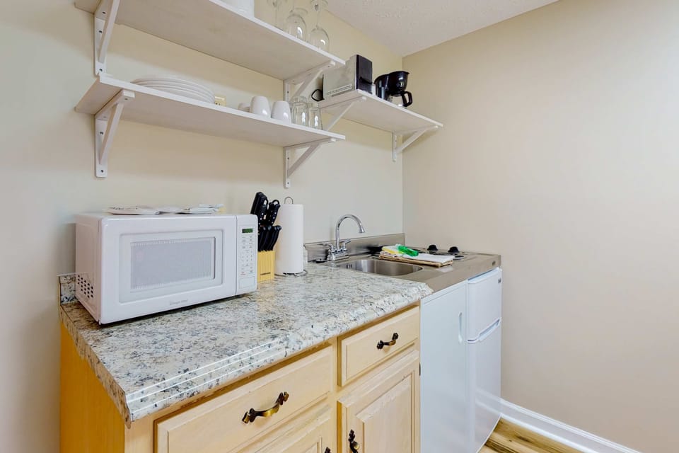 Stylish setup with essential appliances for effortless meal prep and snacks!
