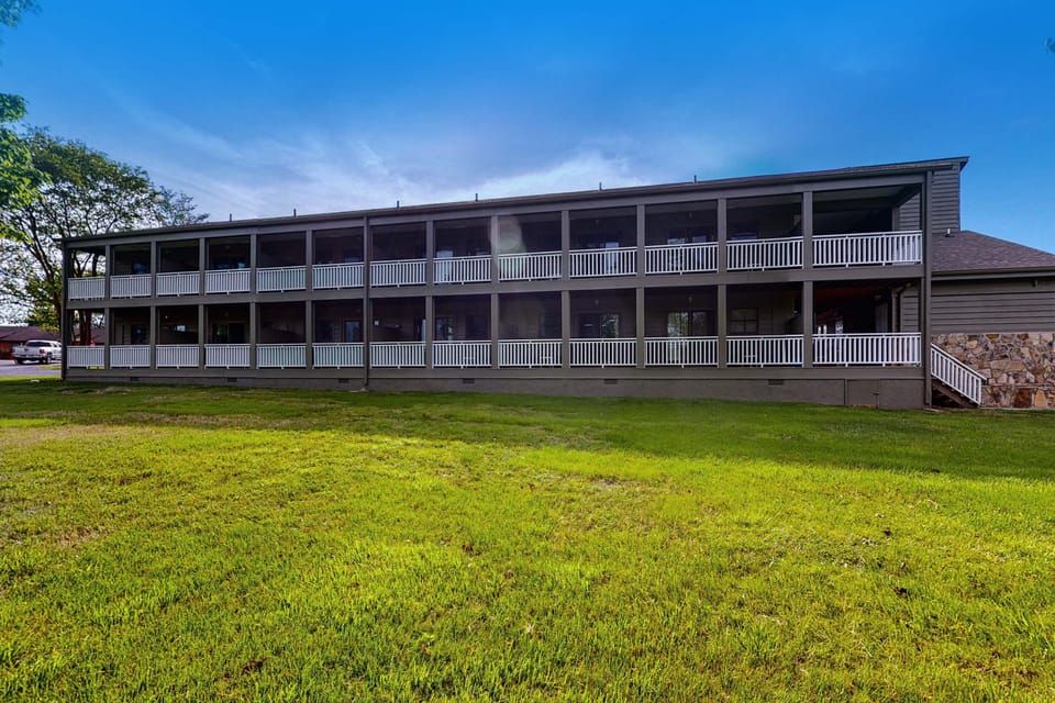 Resort-style building with covered balconies and green space. Steps to shared amenities, easy parking, and quick access to your unit. Great for family vacations, and extended stays.