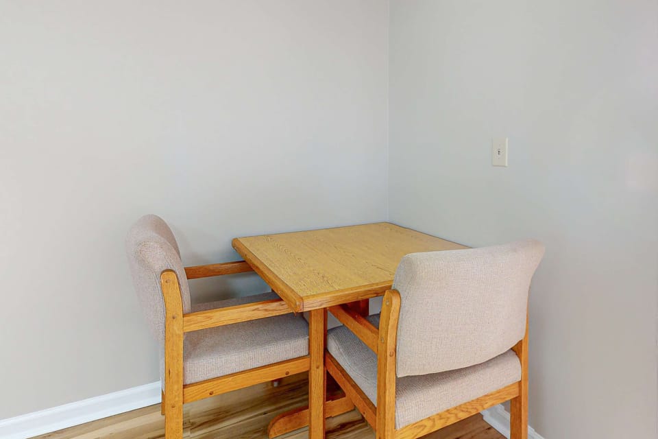 Cozy dining nook for two, eat, work, or play cards. Ideal for couples’ getaway, remote work, extended stay convenience, and relaxing lodging near local attractions.