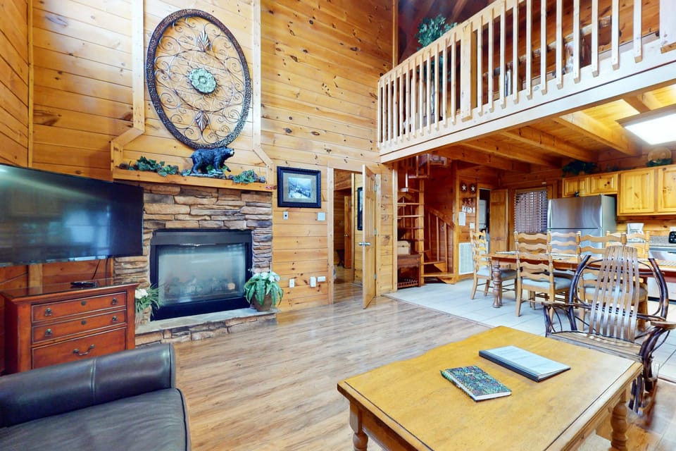 Experience rustic charm with a stone fireplace and warm wooden accents!