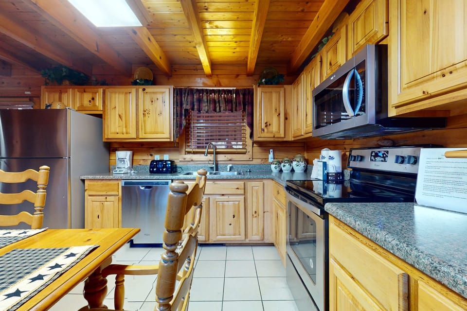 Cook up memories in this charming kitchen with warm wood tones and modern amenities!