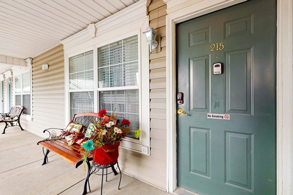 Private unit entrance with covered walkway, easy self check-in, convenient, safe access, and welcoming curb appeal; close to parking, great for weekend trips, business travel, and extended stays.