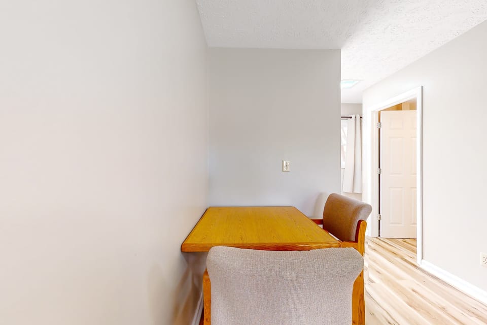 Small dining nook doubles as a work table. Perfect for remote work, business travel, and extended stays. Studio suite with quiet workspace, dining area, and convenient layout.