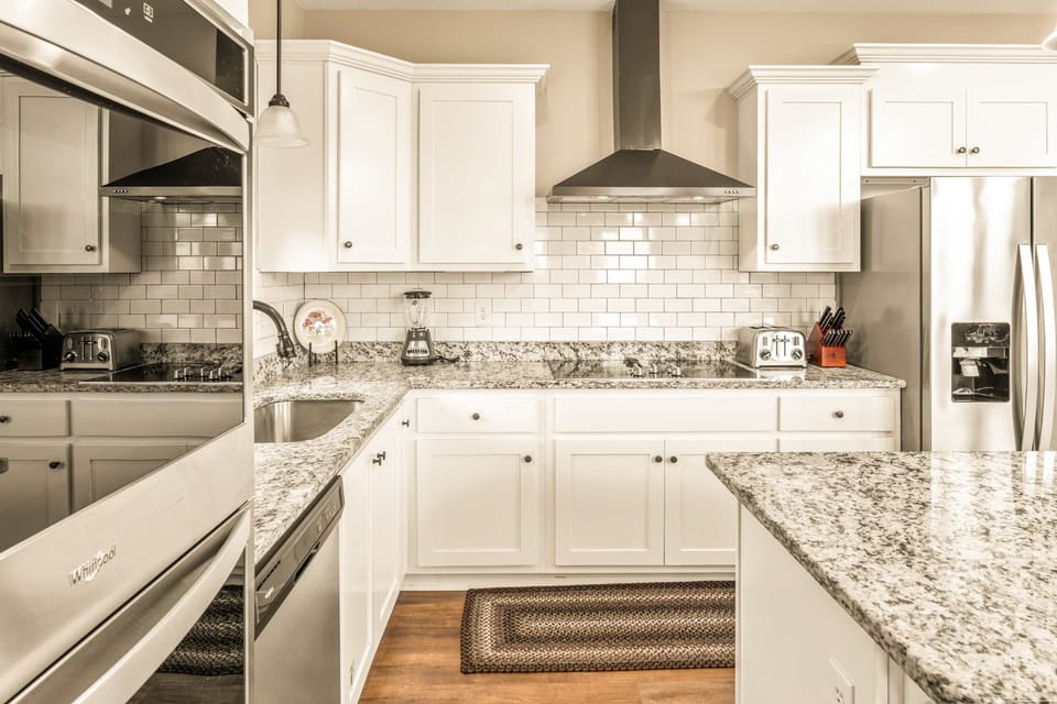 Kitchen paradise awaits. And, whip up culinary delights in a modern kitchen with sleek granite and stylish decor!