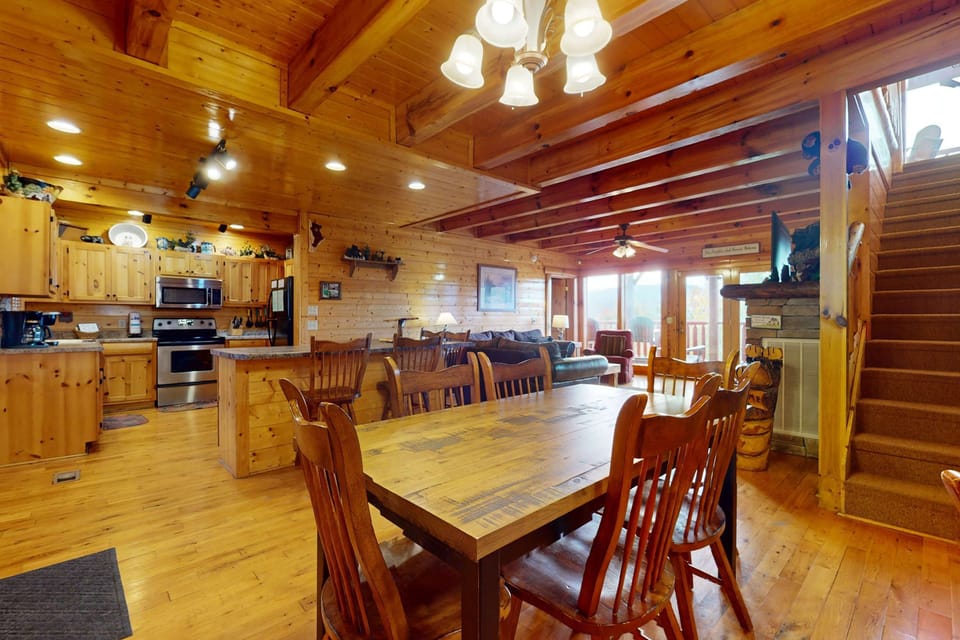Gather 'round in this spacious wood-adorned retreat with stunning views!