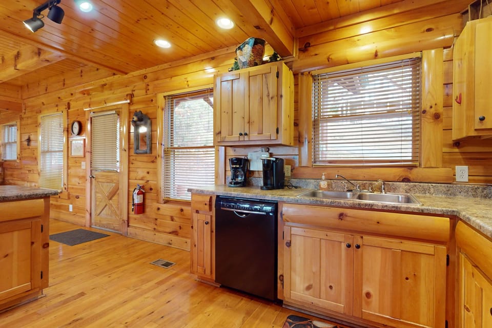 Embrace rustic charm with modern appliances and inviting wood finishes!