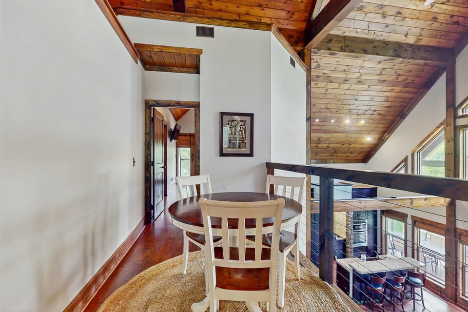Enjoy a cozy loft dining area overlooking the great room. Perfect for morning coffee, board games, or quiet moments.
