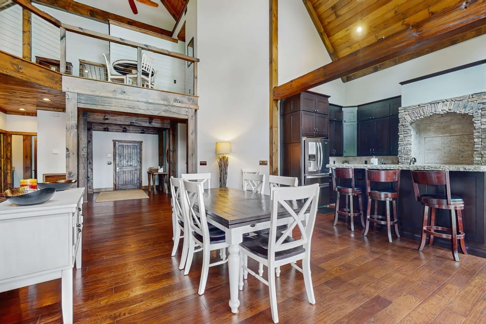 Enjoy seamless entertaining in this open-concept dining and kitchen space, designed for group meals, family gatherings, and upscale lakefront vacations.