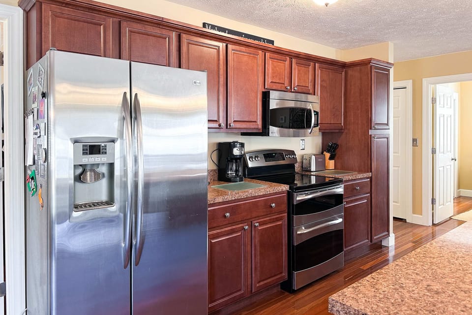 Whip up culinary delights with modern appliances and stylish granite counters!