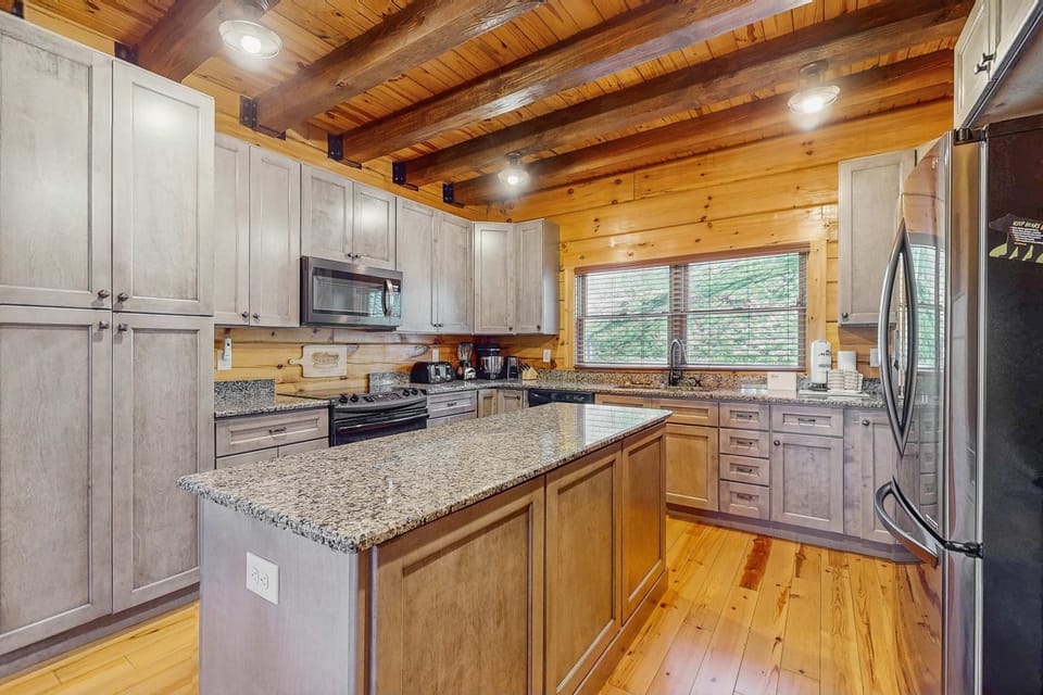 Experience cooking in this stunning kitchen with granite countertops and scenic views!