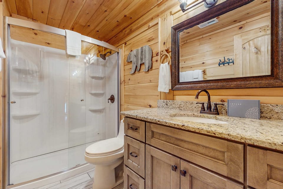 Enjoy a stylish shower and rustic charm in this serene mountain getaway!