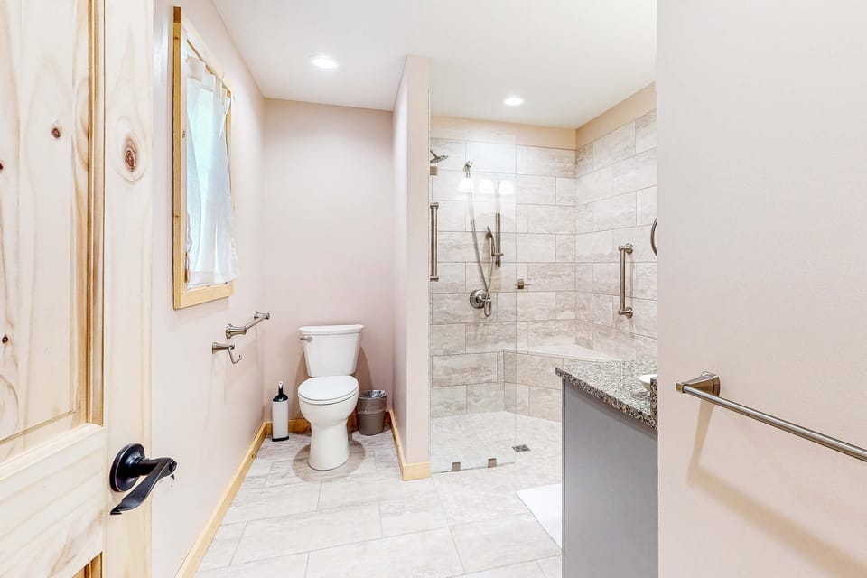 Modern Bathroom, enjoy a sleek walk-in shower and elegant granite finishes in your private retreat!