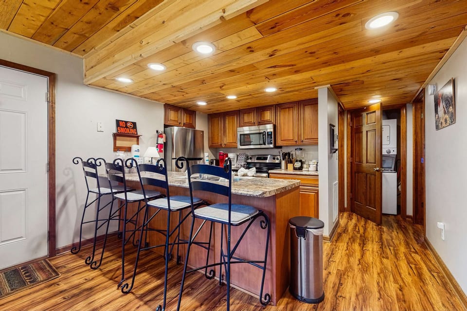 Stylish granite countertops and inviting bar seating for culinary adventures await!
