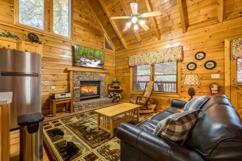 Relax by the stone fireplace, soaking in the warm wood tones and peaceful views!