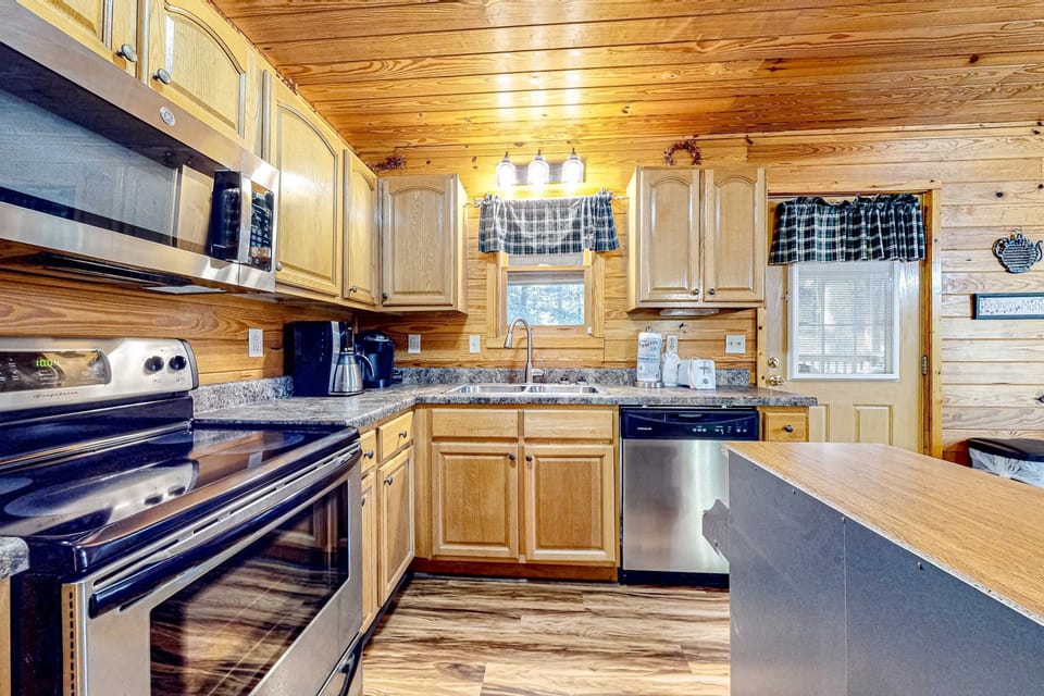 Kitchen haven awaits. Rustic charm meets modern convenience in this well-equipped culinary retreat!