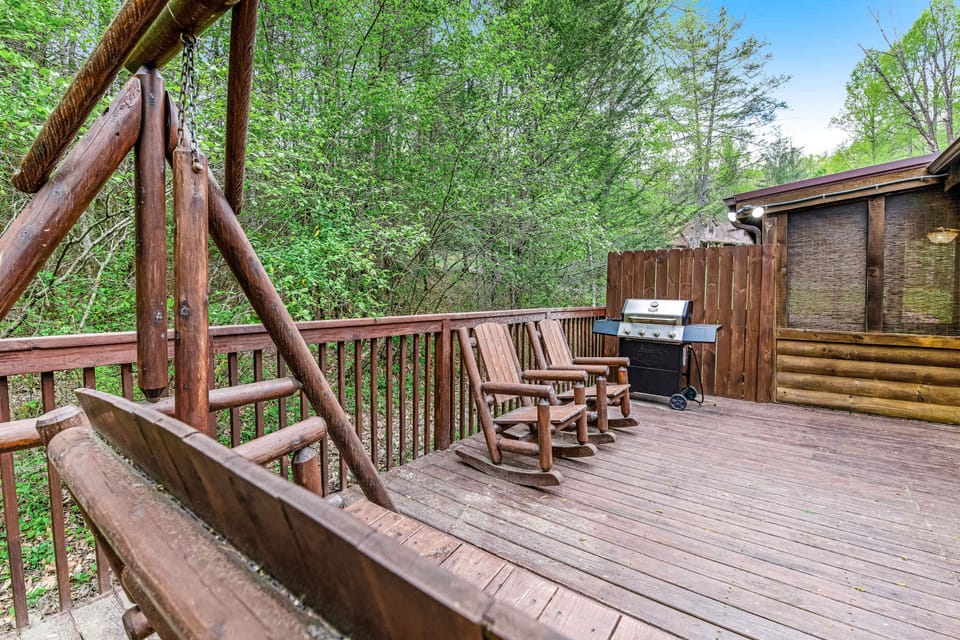 Outdoor deck awaits. And, enjoy nature's beauty from rocking chairs and fire up the grill for a fun cookout!
