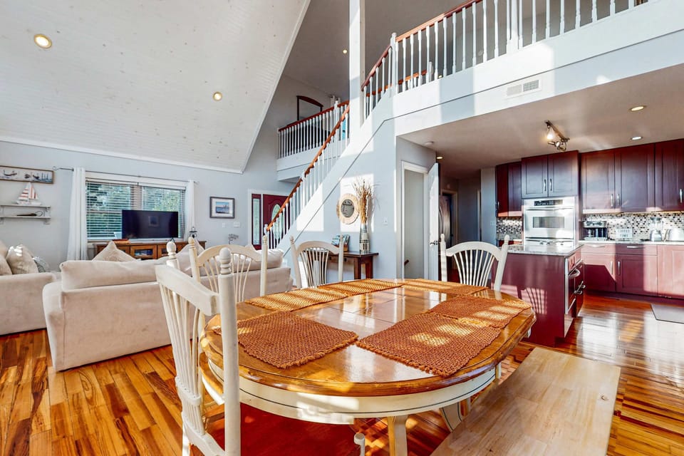 Expansive space with sunlit elegance and a charming dining area for gatherings!