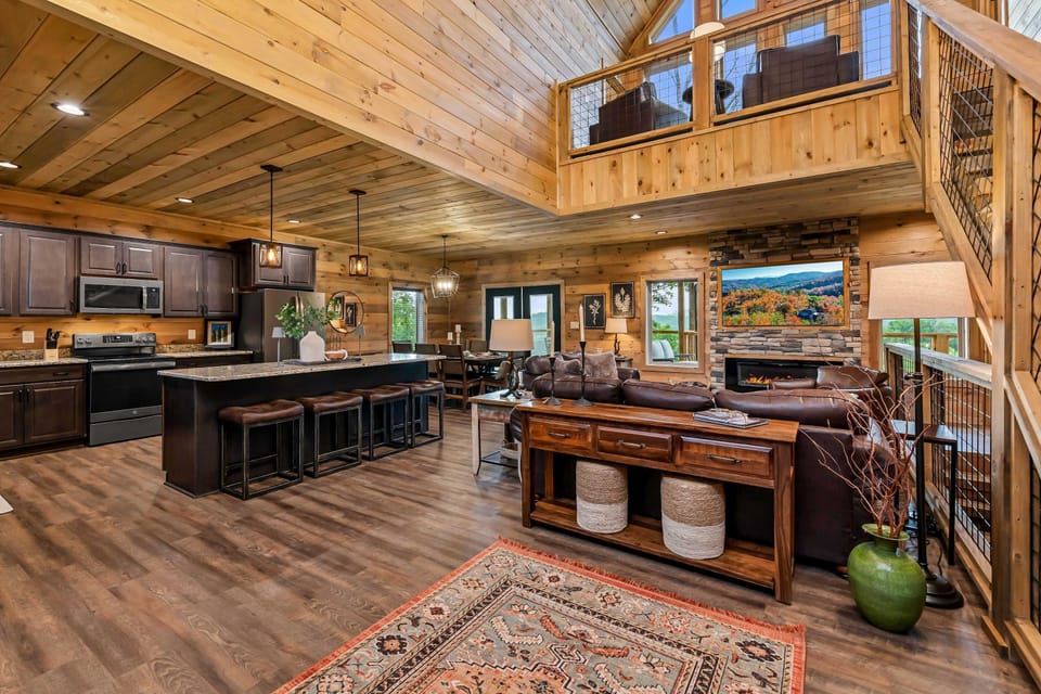 Central hub with stunning views, sleek furniture, and a warm, inviting fireplace!