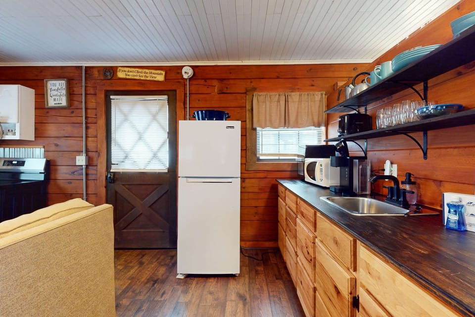 Rustic charm meets modern convenience in this inviting space! Perfect for culinary adventures.