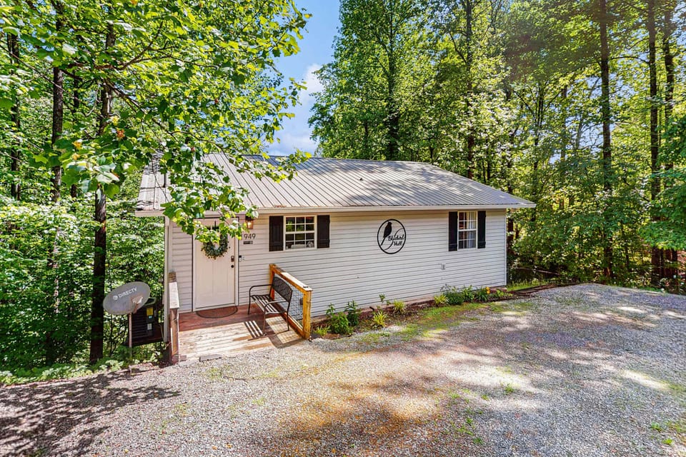 Nestled among trees, this charming retreat is your gateway to nature's beauty!