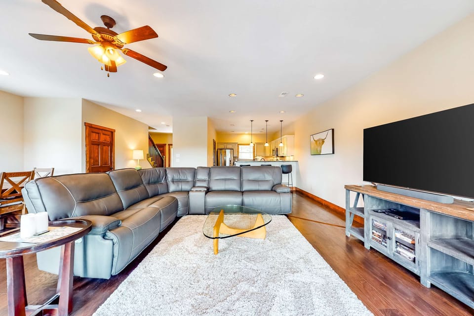 Living room retreat awaits. And, relax on a plush sectional while your culinary creations await in the nearby kitchen!