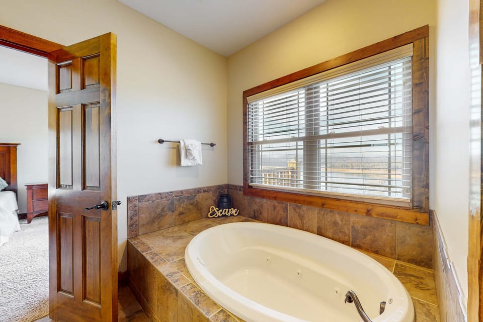 Indulge in relaxation with a soaking tub and scenic views through large windows!