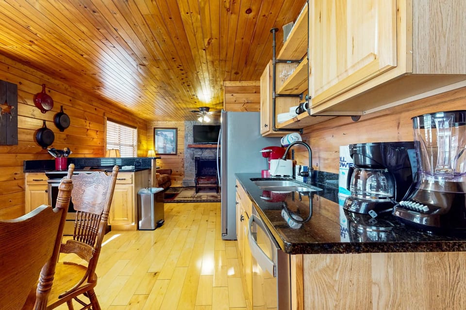 Delight in cooking with style amidst rustic charm and modern appliances!