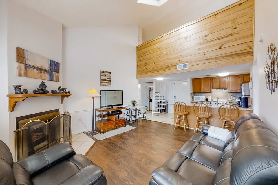 Open-concept living area flowing into the kitchen and dining space. Ideal for entertaining, socializing, and group vacations.